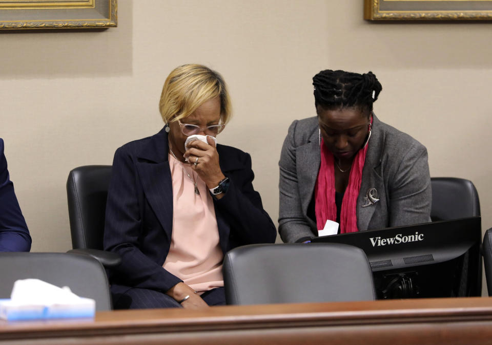 Katie Godwin, center, gets emotional during a sentencing hearing for Frederick Hopkins who pleaded guilty to killing her daughter who was a police deputy in Florence, S.C., on Thursday, Oct. 19, 2023. Hopkins was sentenced to life in prison without parole for killing two police officers and wounding five others in an October 2018 ambush at his Florence home (AP Photo/Jeffrey Collins).