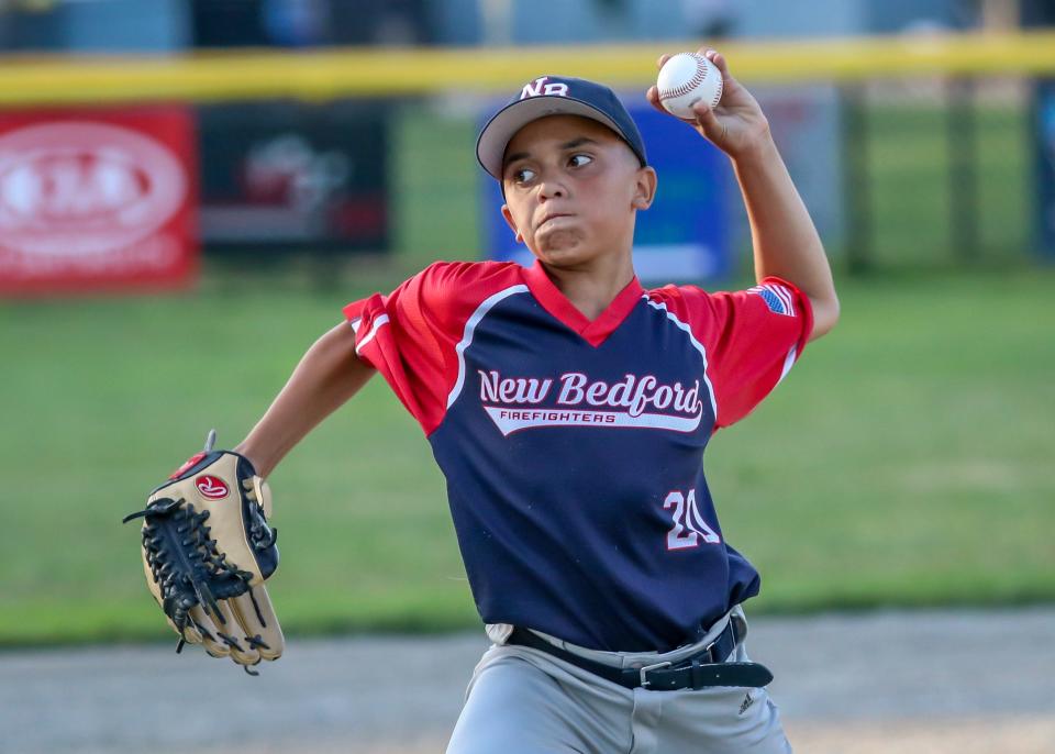 Juan Carlos Robles of New Bedford Fire is completely locked in on his target as he delivers to the plate on Thursday evening at Whaling City Youth Baseball League.