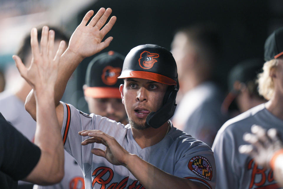 Baltimore Orioles' Ramon Urias returns to the dugout after scoring against the Washington Nationals during the second inning of a baseball game at Nationals Park, Tuesday, Sept. 14, 2022, in Washington. (AP Photo/Jess Rapfogel)