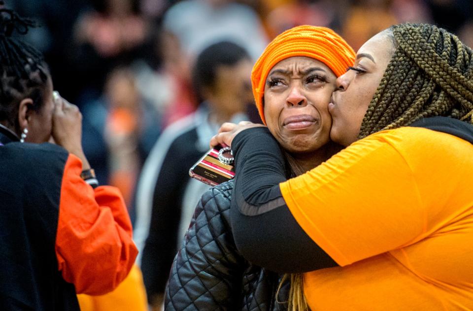 Howard Nathan´s sister Stacey Nathan sheds tears as a photo of the Peoria basketball legend is unveiled Thursday, Feb. 6, 2020 in the Manual High School gymnasium. [MATT DAYHOFF/JOURNAL STAR]