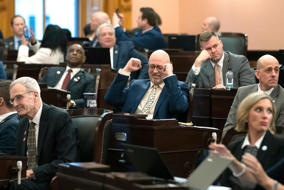 Rep. Gary Click, R-Vickery, pumps his fists after the Ohio House overrides Gov. Mike DeWine’s veto of House Bill 68 on Wednesday.