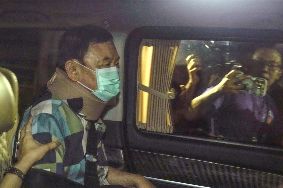 Former Thai Prime Minister Thaksin Shinawatra sits in a vehicle after being released on parole Sunday, Feb. 18, 2024, n Bangkok, Thailand. Thaksin was released from Police General Hospital where for the last six months he had been serving time for corruption-related offenses. (AP Photo/Sakchai Lalit)