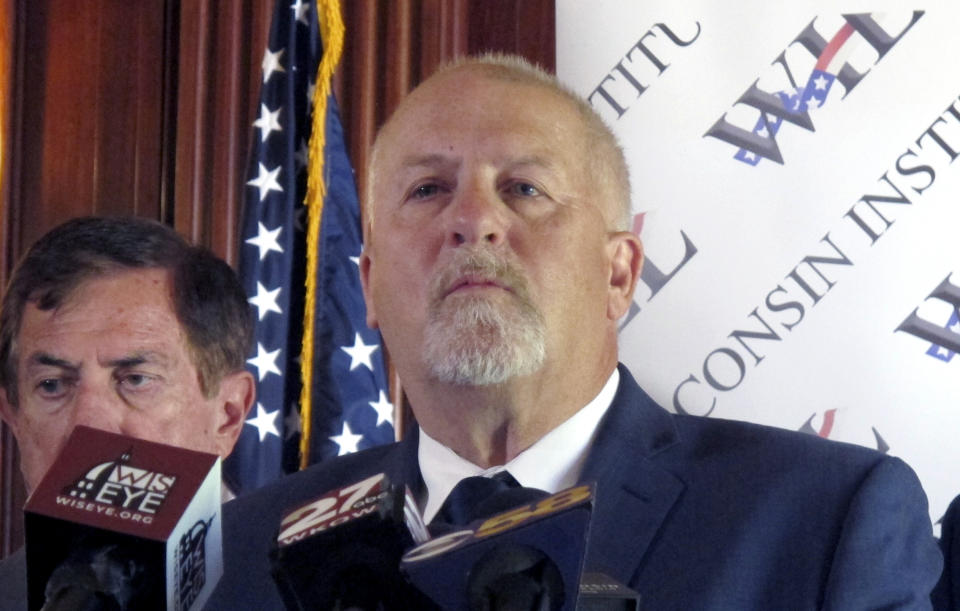 Conservative attorney Rick Esenberg details a new lawsuit asking the Wisconsin Supreme Court to overturn four partial vetoes made by Democratic Gov. Tony Evers and limit the ability of future governors to make similar vetoes during a news conference at the Statehouse in Madison, Wis., Wednesday, July 31, 2019. If successful, the move would reverse more than four decades of precedent. (AP Photo/Scott Bauer)