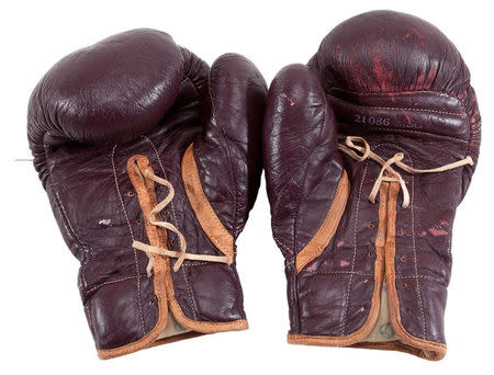 Boxing gloves worn by Muhammad Ali during his March 8, 1971 “Fight of the Century” in Madison Square Garden against Joe Frazier are pictured in this undated handout photo obtained by Reuters July 11, 2016. Goldin Auctions/Handout via REUTERS