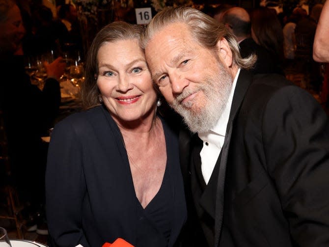 Susan and Jeff Bridges posing together for a photo at an event.