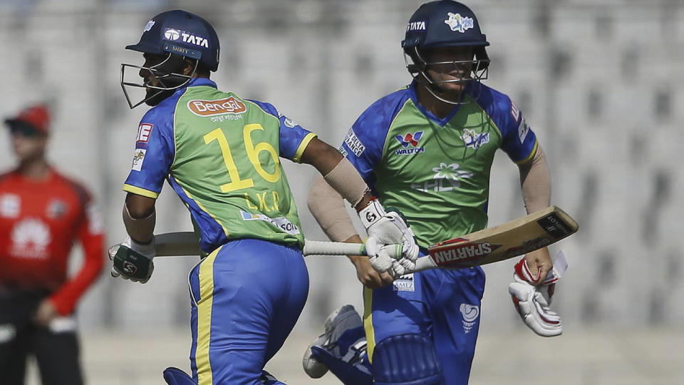 David Warner in action. (Photo by STR/AFP/Getty Images)