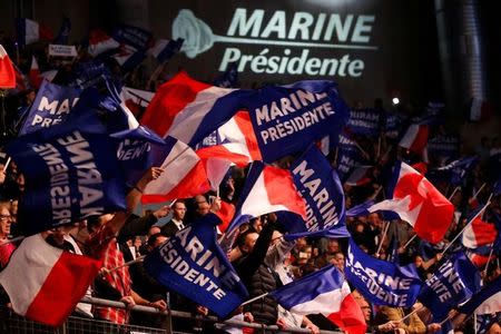 Fans cheer for Marine Le Pen, French National Front (FN) political party leader and candidate for French 2017 presidential election, during a political rally in Lille, France, March 26, 2017. REUTERS/Pascal Rossignol