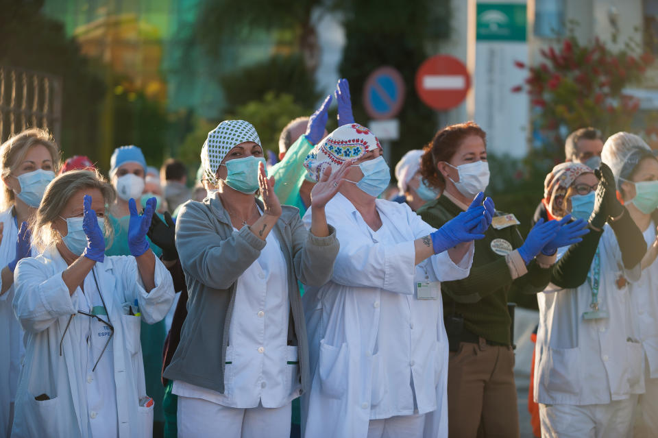  Nurses and doctors of the Regional Hospital in downtown retuning the applause (which has become a custom every evening) to those that show gratitude towards during the fight against the Covid-19 virus outbreak. Spain is the first country in Europe with more than 110.000 people infected and almost 11.000 deaths around the country, according to National Health Service sources. Andalusia is the city with more people infected by the virus. (Photo by Jesus Merida / SOPA Images/Sipa USA) 