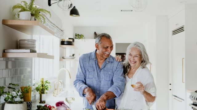 Older couple spending time together in the kitchen.