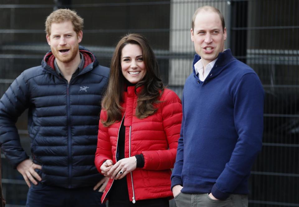 Britain's Prince William, right, Kate the Duchess of Cambridge, centre, and Prince Harry look down the track as they arrive to take part in a short relay race, during a training event to promote the charity Heads Together, at the Queen Elizabeth II Park in London, Sunday, Feb. 5, 2017. (AP Photo/Alastair Grant, Pool)