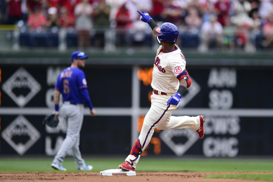 Philadelphia Phillies' Jean Segura celebrates after hitting a solo home run off New York Mets starting pitcher Taijuan Walker during the first inning of a baseball game, Sunday, Aug. 8, 2021, in Philadelphia. (AP Photo/Derik Hamilton)