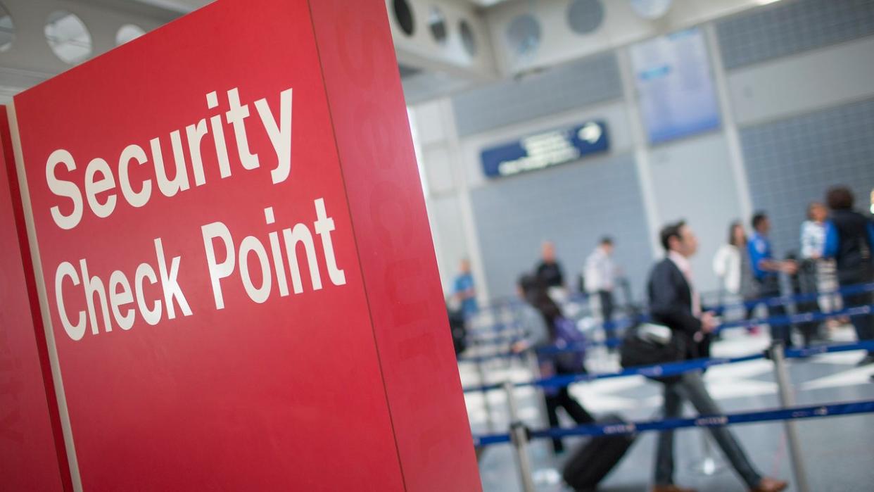 <div>CHICAGO, IL - JUNE 02: A sign directs travelers to a security checkpoint staffed by Transportation Security Administration (TSA) workers at OHare Airport on June 2, 2015 in Chicago, Illinois. The Department of Homeland Security said that the acting head of the TSA would be replaced following a report that airport screeners failed to detect explosives and weapons in nearly all of the tests that an undercover team conducted at airports around the country. (Photo by Scott Olson/Getty Images)</div>