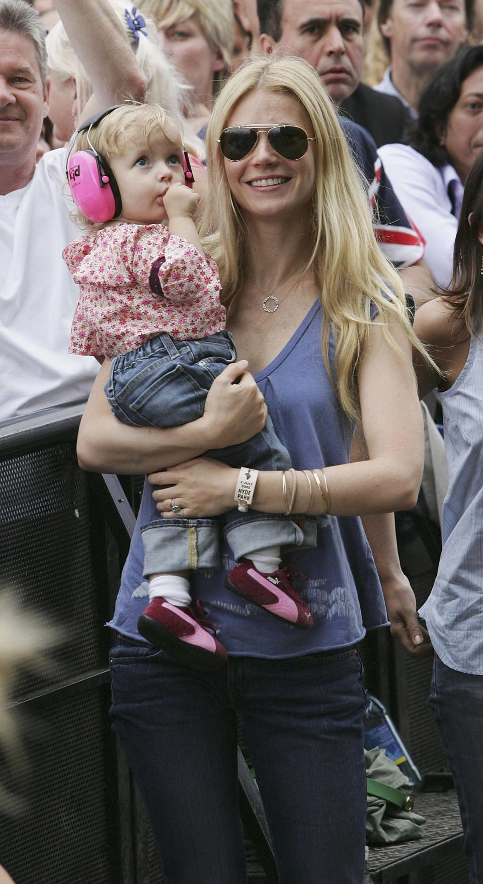 Gwyneth Paltrow and daughter Apple watch Coldplay's Chris Martin perform on stage at "Live 8 London" on July 2, 2005 in London, England.