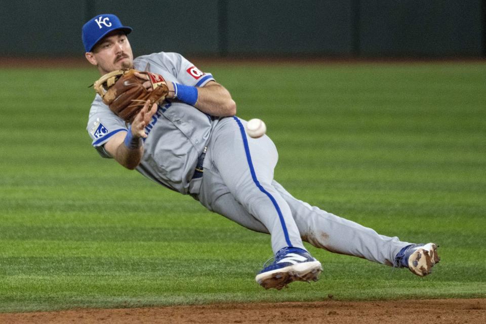 Kansas City Royals second baseman Nick Loftin throws to second on a fielder's choice hit by Texas Rangers' Jonah Heim during the sixth inning of a baseball game, Friday, June 21, 2024, in Arlington, Texas. (AP Photo/Jeffrey McWhorter)