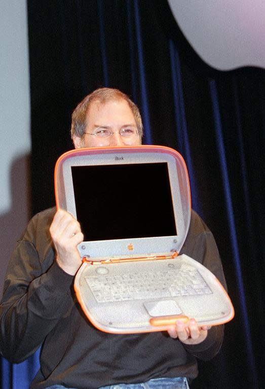 Interim chief executive of Apple Computer Steve Jobs the Power Mac iBook G3 in Paris on September 15, 1999