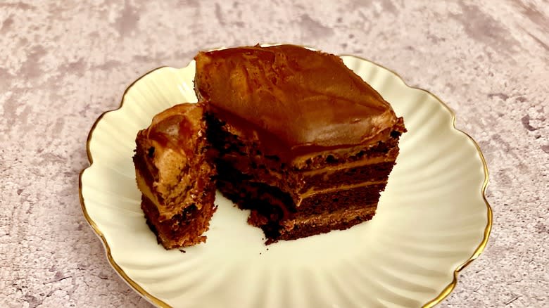 Cut slice of chocolate lasagne showing layers