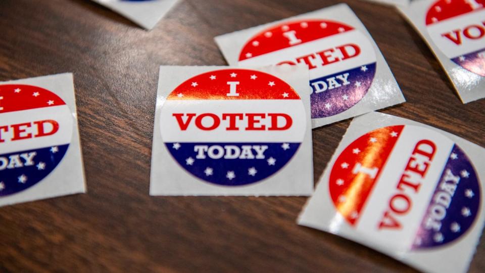 PHOTO: 'I voted stickers' line a table at Gloucester High School in Gloucester, Massachusetts, during the Super Tuesday presidential primary, Mar. 5, 2024.  (Joseph Prezioso/AFP via Getty Images)