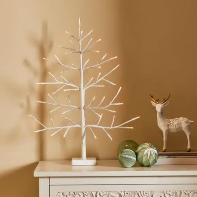 Dress up your shelf for the festivities with this dainty twig tree