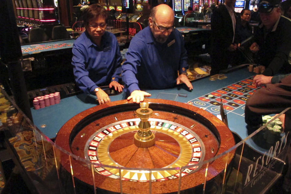 Dealers conduct a game of roulette at Resorts Casino in Atlantic City, N.J. on April 20, 2018. The Mohegan tribe will end its management of Atlantic City's Resorts casino at the end of this year, both parties said Monday, Feb. 26, 2024. (AP Photo/Wayne Parry)