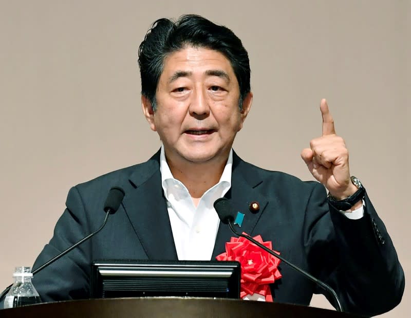 Japan's Prime Minister Shinzo Abe makes a speech in Fukuoka, Japan, in this photo taken by Kyodo July 27, 2016. Mandatory credit Kyodo/via REUTERS ATTENTION EDITORS - THIS IMAGE WAS PROVIDED BY A THIRD PARTY. EDITORIAL USE ONLY. MANDATORY CREDIT. JAPAN OUT. NO COMMERCIAL OR EDITORIAL SALES IN JAPAN.