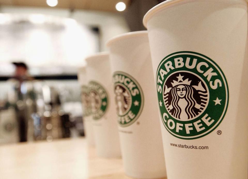 Starbucks BOGO Fall Coffee Pumpkin. Beverage cups featuring the logo of Starbucks Coffee are seen in the new flagship store on 42nd Street August 5, 2003 in New York City. The chain has a buy one, get one deal taking place every Thursday in September to celebrate its fall drink menu.