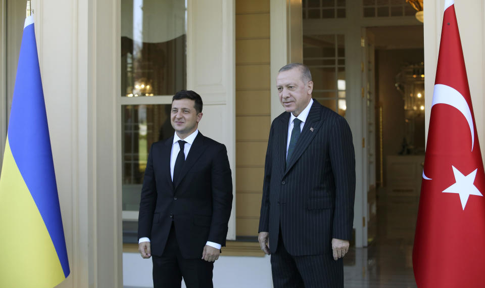Turkish President Recep Tayyip Erdogan, right, and Ukrainian President Volodymyr Zelenskiy pose for photographs prior to a meeting, in Istanbul, Friday, Oct. 16, 2020. President Zelenskiy is in Istanbul for a one-day working visit. (Turkish Presidency via AP, Pool)