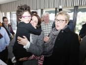 Parti Quebecois leader Pauline Marois (R ) smiles as local candidate Djemila Benhabib greets her daughter Frida during a campaign stop in Laval, Quebec, March 7, 2014. Quebec voters will go to the polls in a provincial election April 7. REUTERS/Christinne Muschi (CANADA - Tags: POLITICS ELECTIONS)