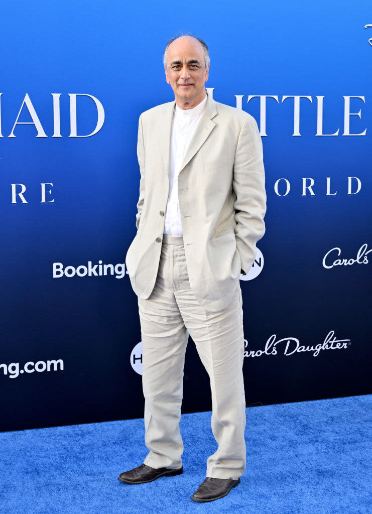 Art Malik at "The Little Mermaid" premiere wearing a casual linen suit