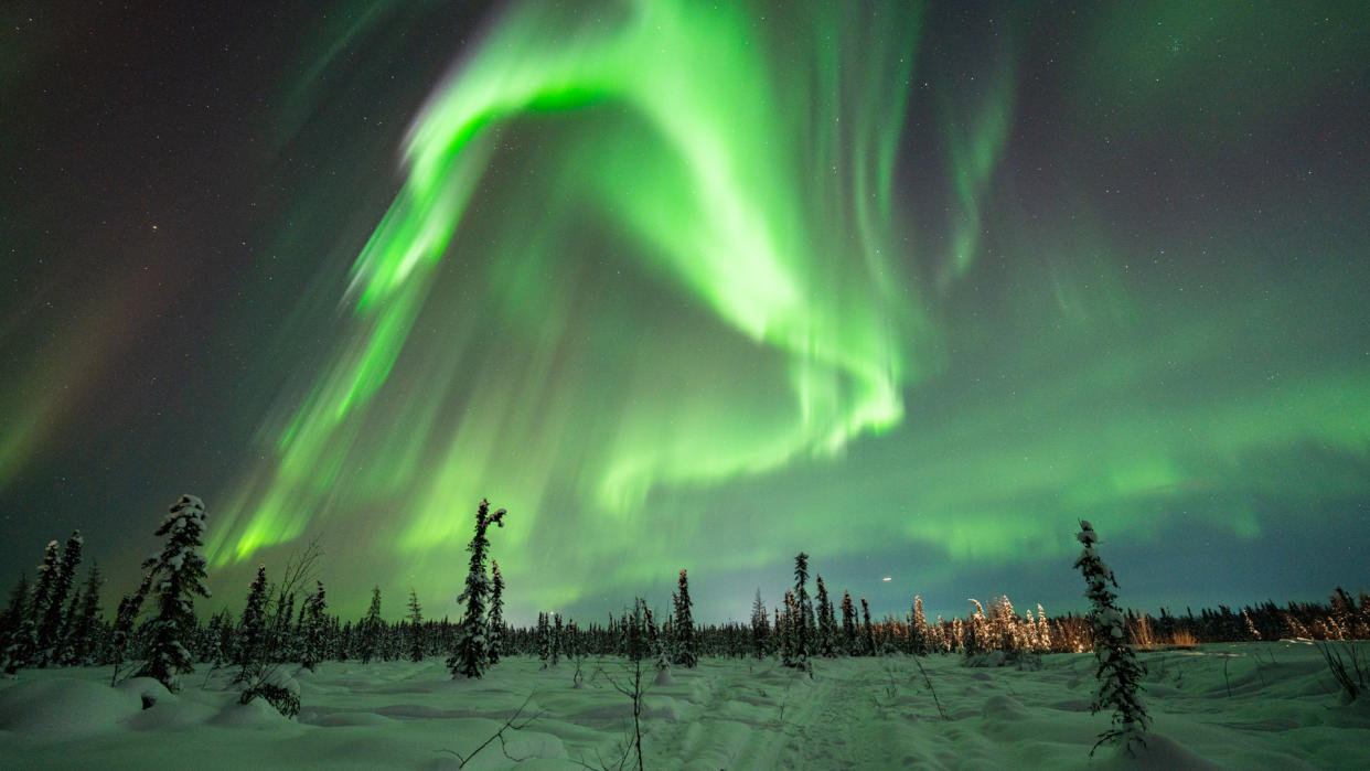  Supercharged auroras glow over Alaska in an image capture on the night of Valentine's Day 2023. 