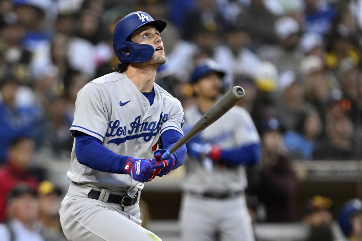 Dodgers' James Outman watches his two-run home run against the San Diego Padres during the 10th inning.