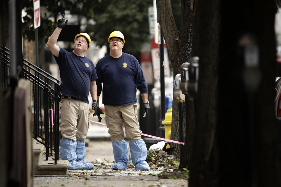 Authorities investigate the scene of Saturday's fatal car explosion in Allentown, Pa., Monday, Oct. 1, 2018. (AP Photo/Matt Rourke)