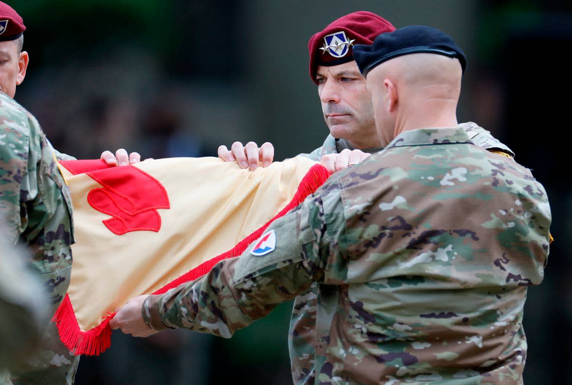 Lt. Gen. Christopher Donahue, Commanding General of the XVIII Airborne Corps and Ft. Liberty, helps case the Ft. Bragg garisson colors during a ceremony redesignating Fort Bragg as Fort Liberty Friday, June 2, 2023. Ft. Liberty, with a population of 282,000 including over 50,000 service members, is the largest military installation by population in the country. The redesignation was mandated in the 2021 National Defense Authorization Act as part of an effort to remove titles with ties to the confederacy. Fort Bragg was named after Gen. Braxton Bragg, a Confederate officer and North Carolina native.