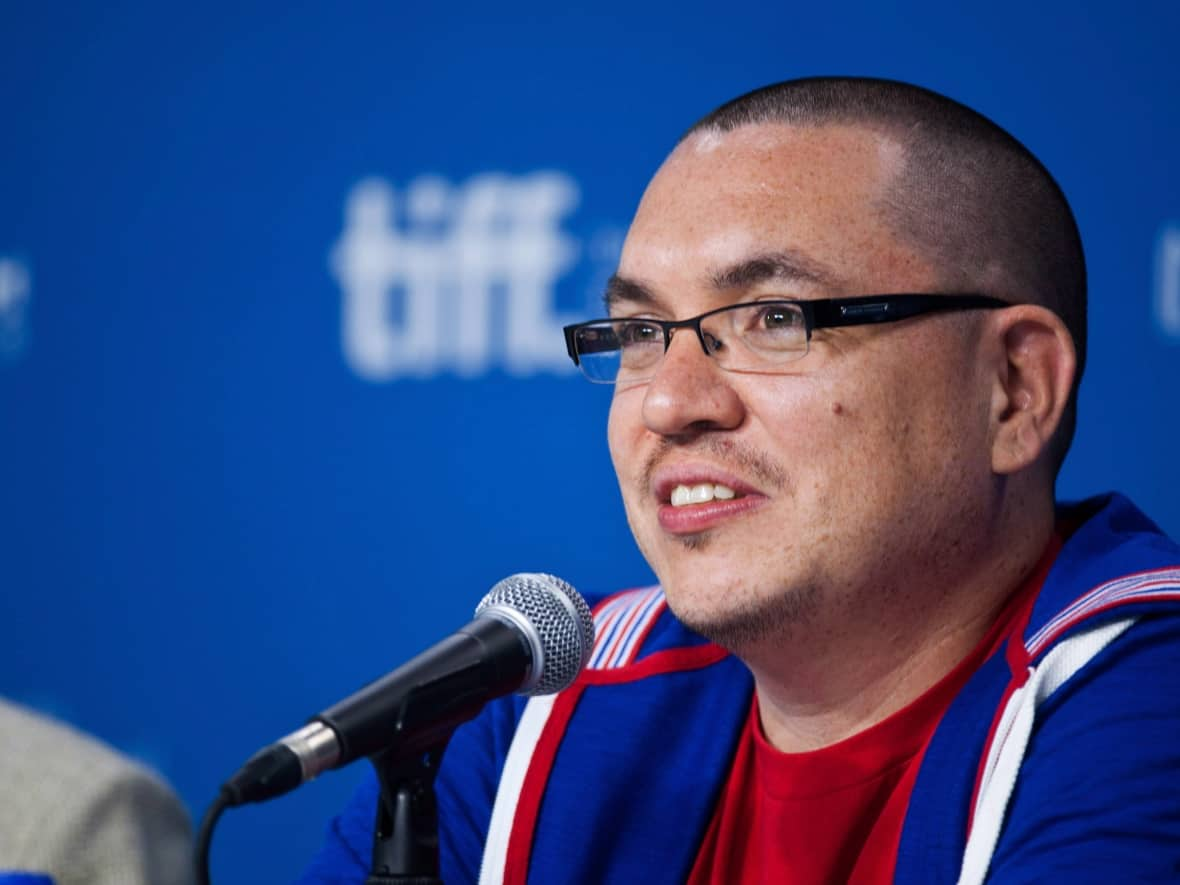 Director Jeff Barnaby speaks during a press conference at the 2013 Toronto International Film Festival in Toronto on Sept. 6, 2013. The celebrated filmmaker, whose Rhymes for Young Ghouls and Blood Quantum helped define modern Indigenous cinema, has died.  (Galit Rodan/The Canadian Press - image credit)