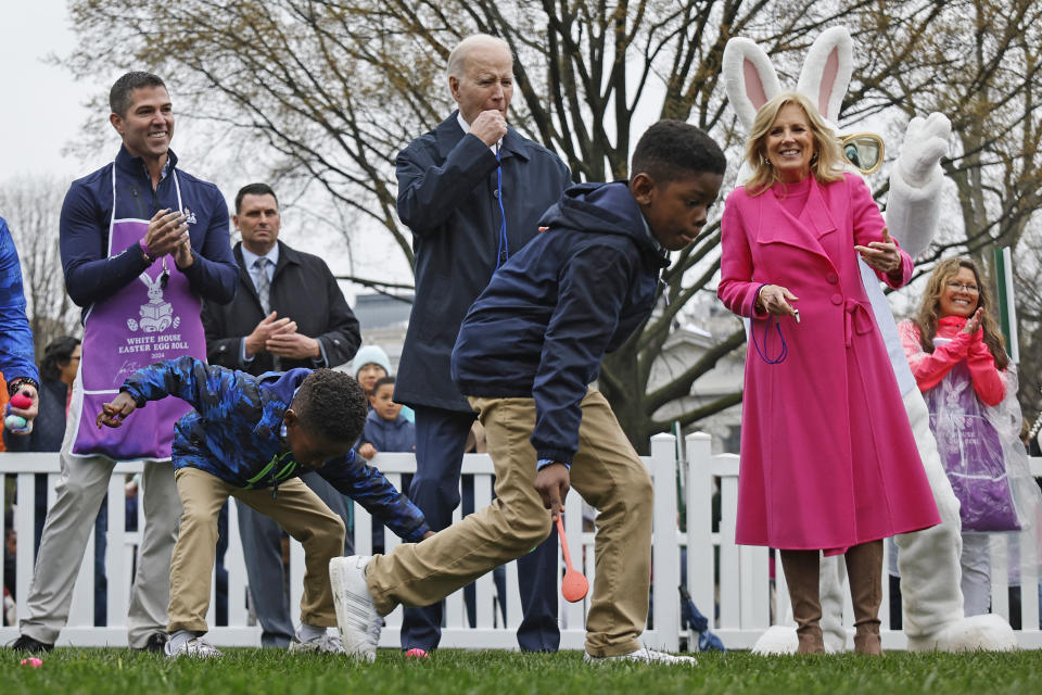 jill biden pink coat dress, WASHINGTON, DC - APRIL 01: U.S. President Joe Biden blows a whistle to kick off the White House Easter Egg Roll with first lady Jill Biden on the South Lawn on April 01, 2024 in Washington, DC. The White House said they are expecting thousands of children and adults to participate in the annual tradition of rolling colored eggs down the White House lawn, a tradition started by President Rutherford B. Hayes in 1878.  (Photo by Chip Somodevilla/Getty Images)