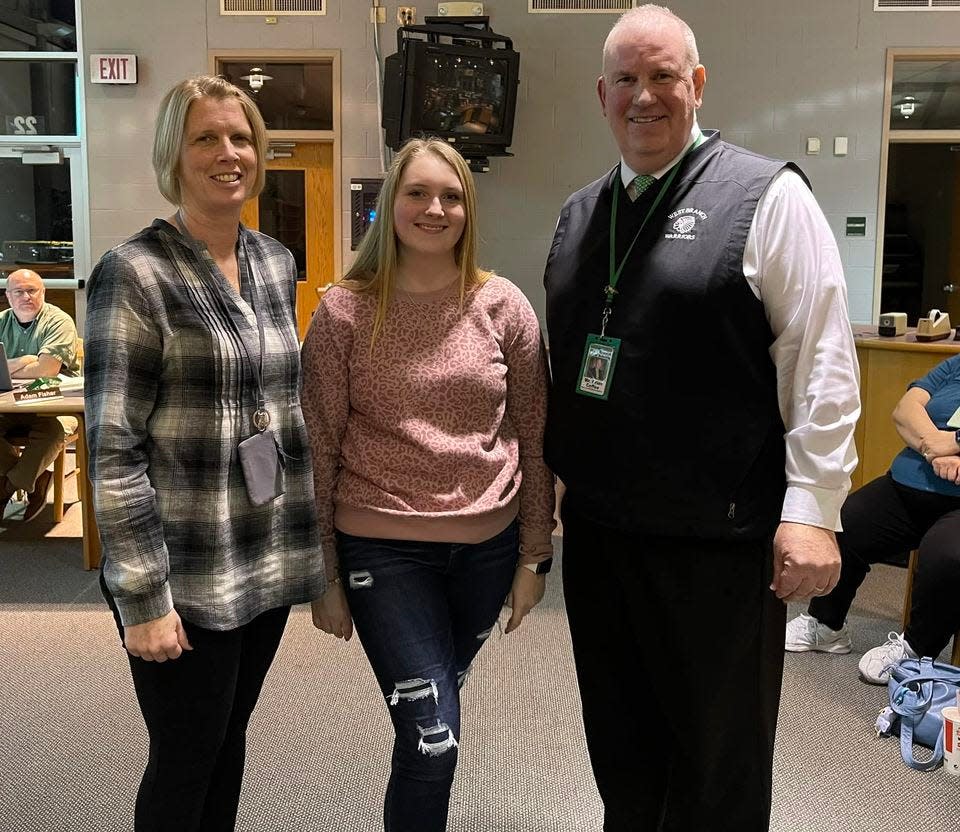 January’s honored student Olivia Greeneisen, center, with West Branch High School Assistant Principal Penny DeShields, left, and Principal Brian Coffee.
