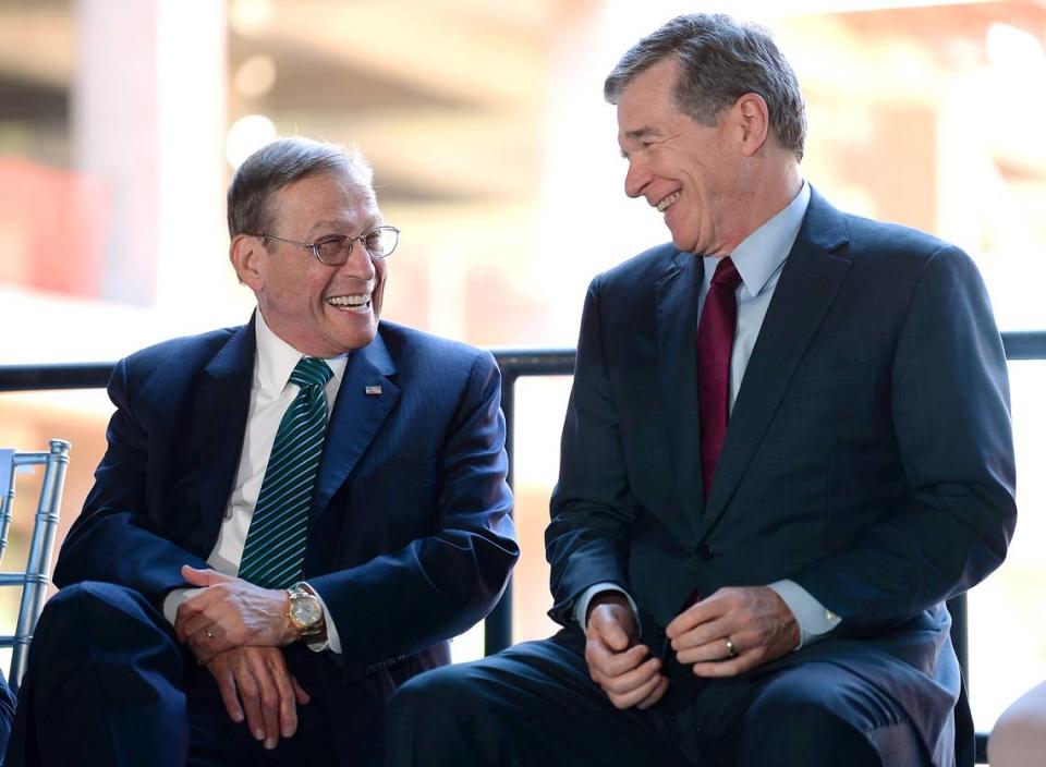 Centene CEO Michael Neidorff, left, and Gov. Roy Cooper during a dedication ceremony in June 2021 of what was to be Centene’s new East Coast headquarters.