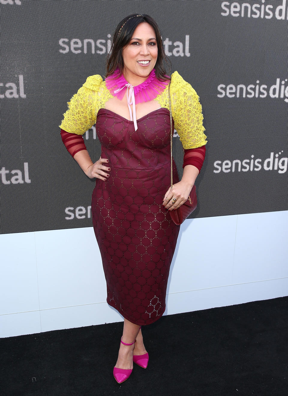 A photo of Kate Ceberano wearing a pink and yellow dress at the Sensis Marquee on Oaks Day at Flemington Racecourse on November 9, 2017 in Melbourne, Australia.