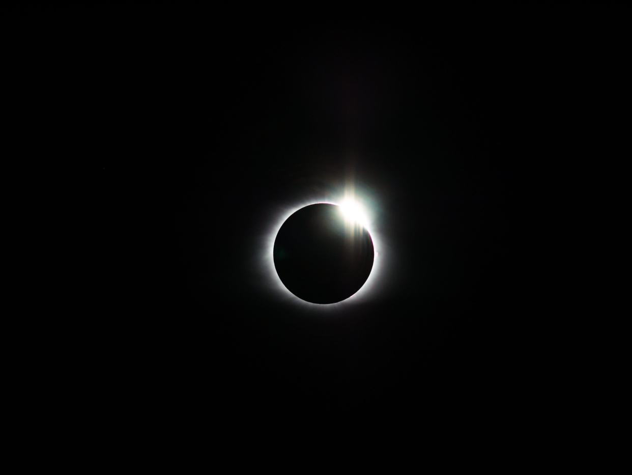 The sun is eclipsed by the moon and the sun's corona can be seen during a total solar eclipse on Monday, August 21, 2017. This image was captured in Deep Creek, Bryson City, North Carolina.