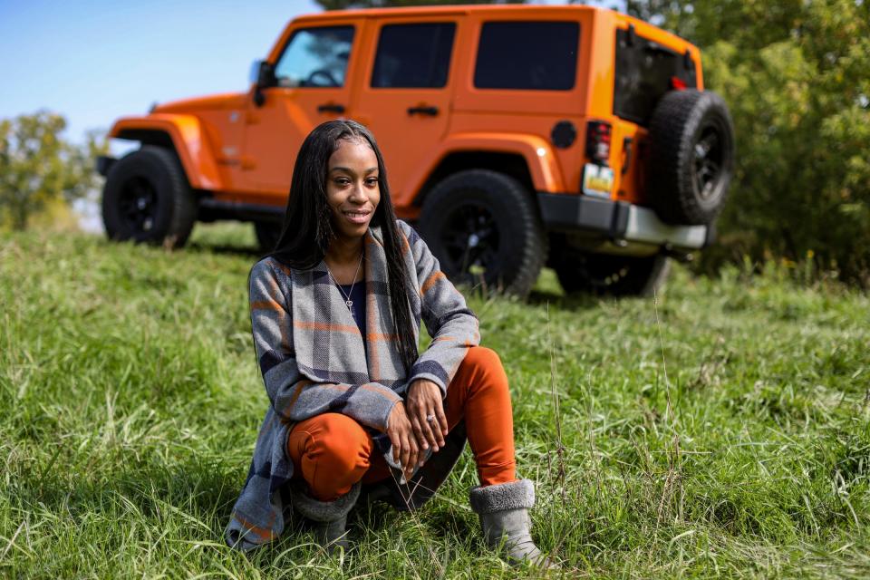 Anniece Jamison, 24, of Sterling Heights owns a 2014 Jeep Wrangler four-door Limited Sahara for two years and is a member of Detroit Black Jeep Hers. Jamison she has always dreamed of owning a jeep since she was a child and played with a Barbie Jeep toy. Jamison is photographed with her Jeep at River Bends Park in Shelby Twp, on Sept. 22, 2020.