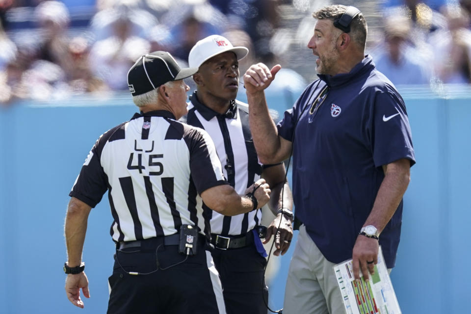 Tennessee Titans head coach Mike Vrabel speaks to line judge Jeff Seeman (45) during the first half of an NFL football game against the Cincinnati Bengals, Sunday, Oct. 1, 2023, in Nashville, Tenn. (AP Photo/George Walker IV)