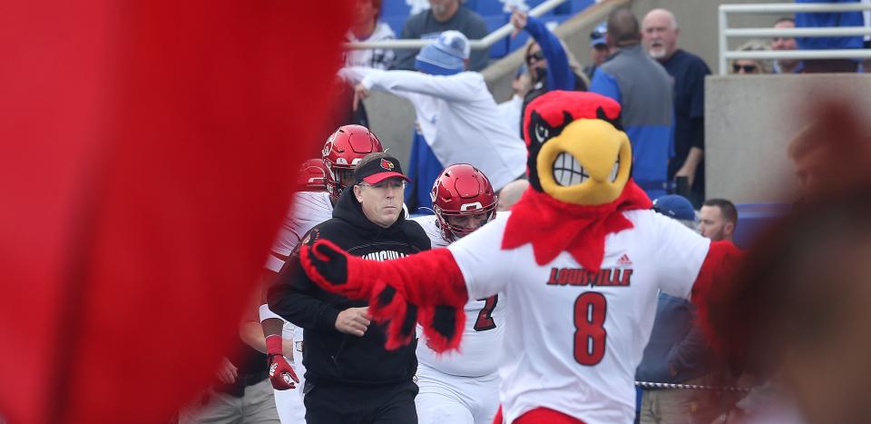 Former Louisville coach Scott Satterfield takes the field in a 2022 game vs. UK. Satterfield left behind the remnants of a strong running game in 2023 despite leaving for Cincinnati.