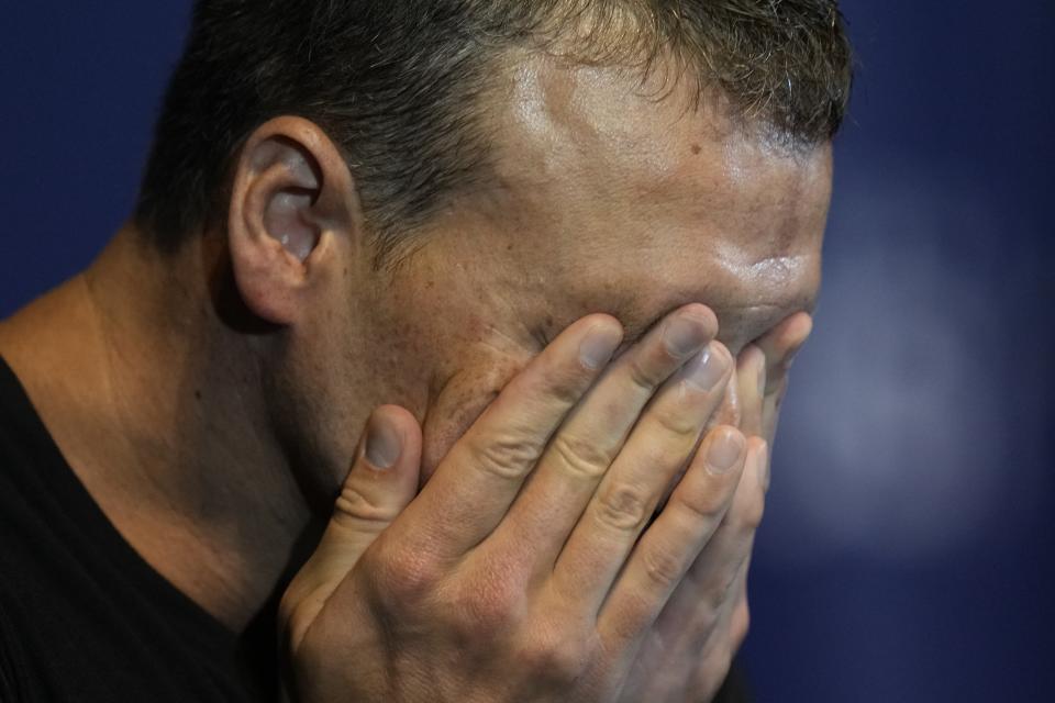 Ryan Lochte crys during an interview after the men's 200 individual medley during wave 2 of the U.S. Olympic Swim Trials on Friday, June 18, 2021, in Omaha, Neb. (AP Photo/Jeff Roberson)
