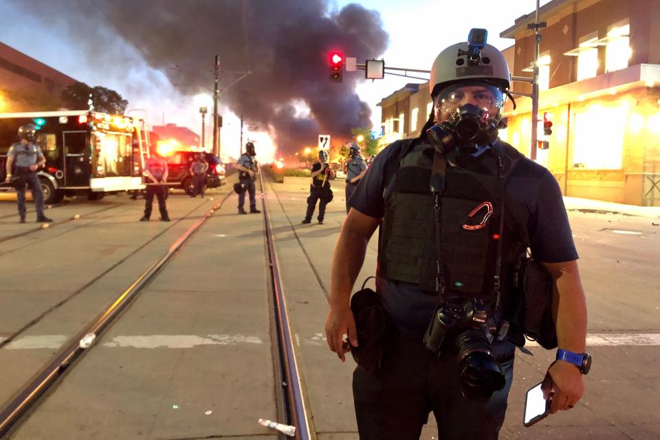 Associated Press photographer Julio Cortez is photographed at the scene of a protest on Thursday, May 28, 2020, in Minneapolis. (AP Photo/John Minchillo)