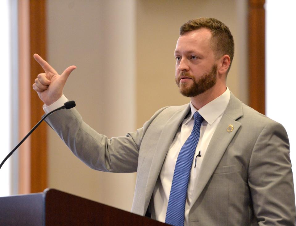 Assistant State Attorney Ethan Dunn cross examines a witness during the sentencing hearing Friday for John Pyle. Pyle was charged with 30 counts of possession of child pornography and one could of failure to appear.