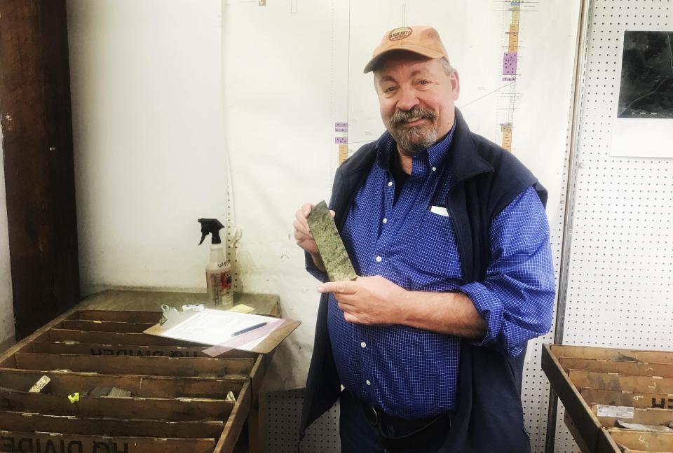 Jerry Zieg,&nbsp;senior vice president of Sandfire Resources America, holds up a copper-laden chunk of rock at the company's office in White Sulphur Springs. (Photo: CHRIS D’ANGELO/HUFFPOST)