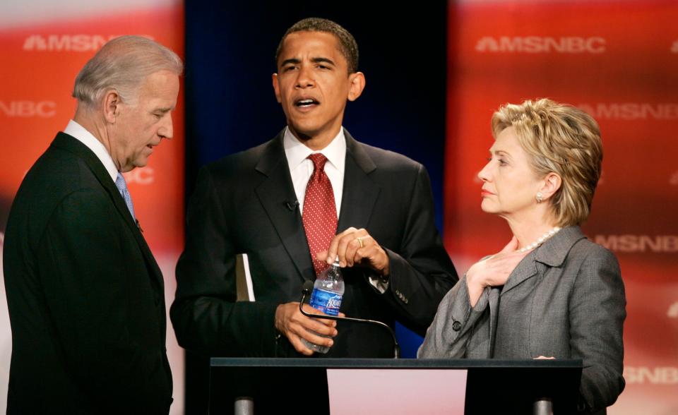 Sen. Joe Biden, D-Del., left, talks with then-Sen.