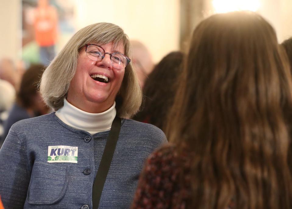 Sandra Kurt, the Summit County clerk who was elected the Akron clerk, talks to a supporter during the election night party at Akron Civic Theatre in Akron on Tuesday.
