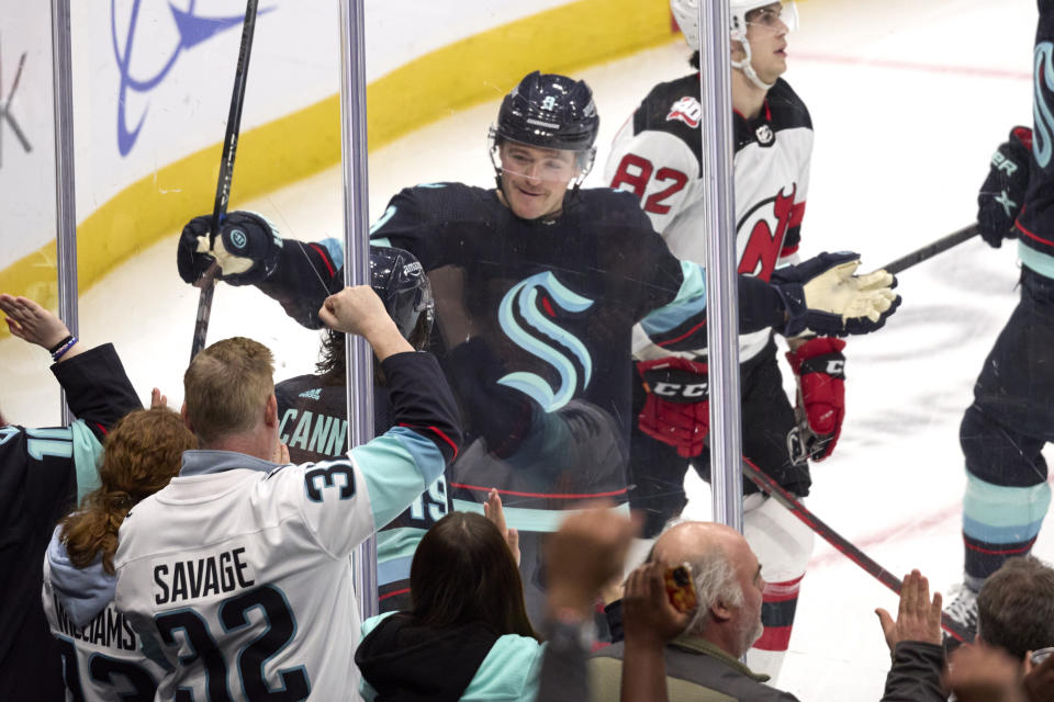 Seattle Krakencenter Ryan Donato (9) celebrates after scoring against the New Jersey Devils during the second period of an NHL hockey game, Thursday, Jan. 19, 2023, in Seattle. (AP Photo/John Froschauer)