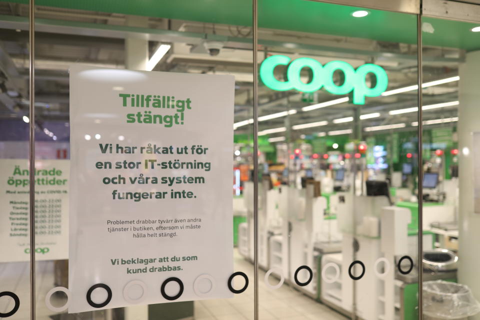 FILE - In this July 3, 2021 file photo, a sign reads: " Temporarily Closed. We have an IT-disturbance and our systems are not functioning", posted in the window of a closed Coop supermarket store in Stockholm, Sweden. Cybersecurity teams worked feverishly Sunday July 4, 2021, to stem the impact of the single biggest global ransomware attack on record, with some details emerging about how the Russia-linked gang responsible breached the company whose software was the conduit. The Swedish grocery chain Coop said most of its 800 stores would be closed for a second day Sunday because their cash register software supplier was crippled. (Ali Lorestani/TT via AP, File)
