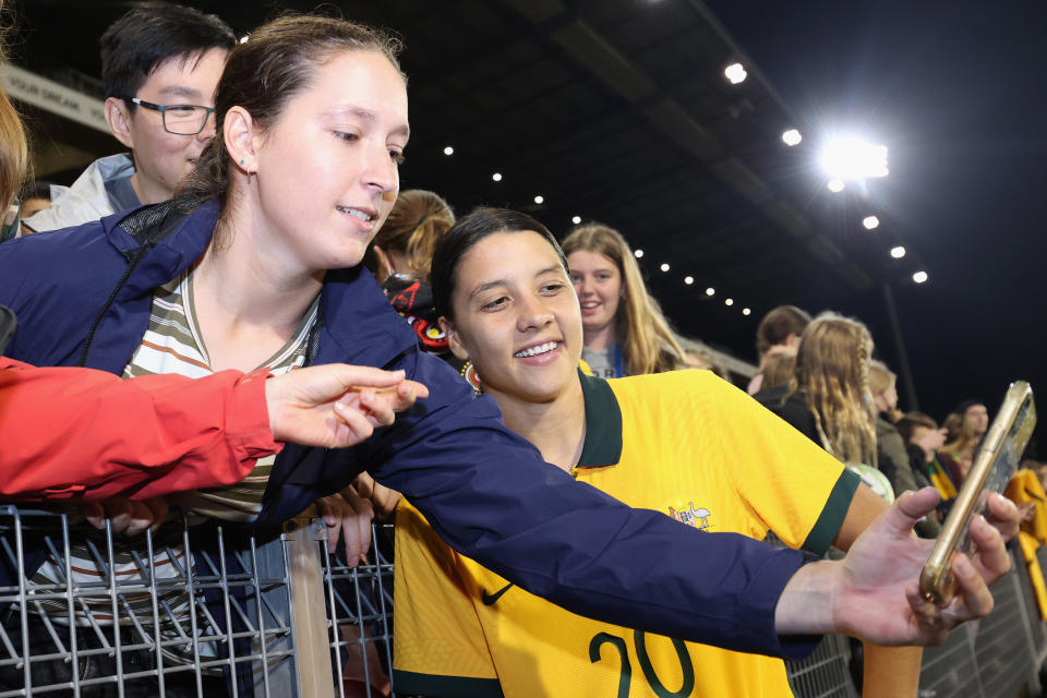 Seen here, Matildas star Sam Kerr shares a selfie with a fan after Australia's 1-1 draw with the USA.